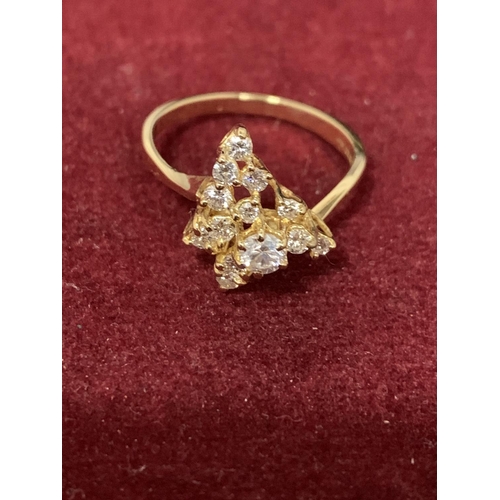 587 - A DECORATIVE ABSTRACT DESIGN 18 CARAT GOLD DIAMOND CLUSTER RING 3.47G APPROXIMATELY 60 PTS SIZE: O