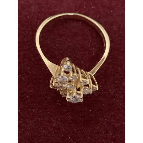 587 - A DECORATIVE ABSTRACT DESIGN 18 CARAT GOLD DIAMOND CLUSTER RING 3.47G APPROXIMATELY 60 PTS SIZE: O