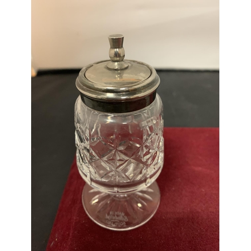 654 - A CUT GLASS CRUET WITH HALL MARKED SILVER TOPS AND A FURTHER MUSTARD POT