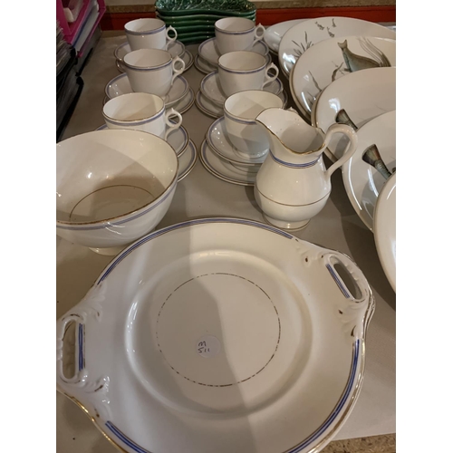 930 - A LARGE QUANTITY OF JOHNSON BROS FISH TABLE WARE TO INCLUDE A SELECTION OF CUPS AND SAUCERS