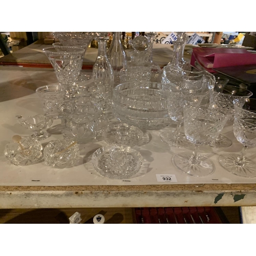 932 - A VARIETY OF CUT GLASS WARE TO INCLUDE DECANTERS, VASES AND GLASSES ETC