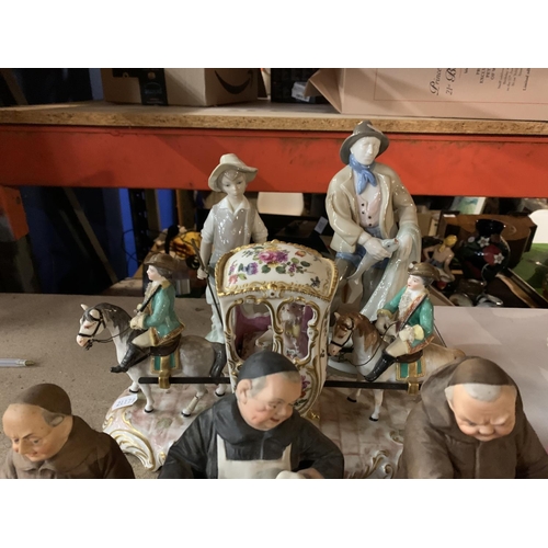 950 - A VARIETY OF CERAMIC FIGURINES AND A PIECE OF EMBROIDERY