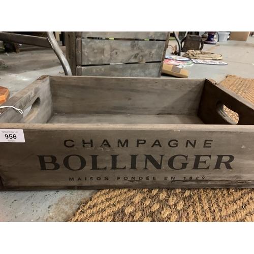 956 - A STURDY WOODEN 'CHAMPAGNE BOLLINGER' CRATE WITH METAL CORNER DETAIL