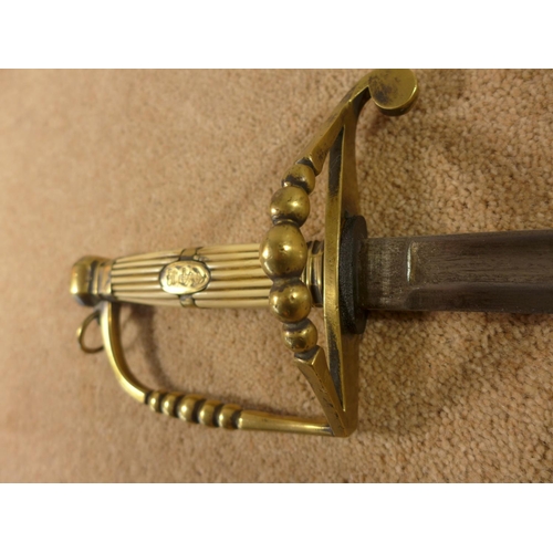 329A - A NAVAL SWORD OF UNKNOWN AGE, THE GRIP DECORATED WITH AN ANCHOR, COMPLETE WITH SCABBARD