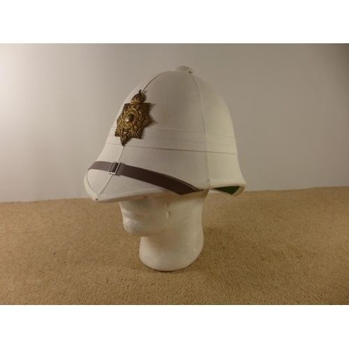 330A - A ROYAL MARINES WHITE PITH HELMET AND BADGE
