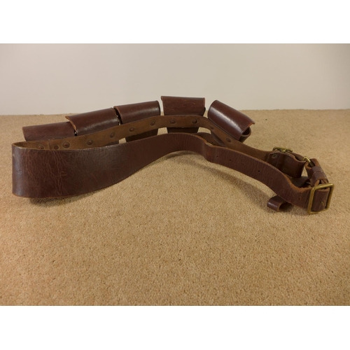 353 - A BROWN LEATHER CARTRIDGE BELT, SAM BROWNE BELT ETC