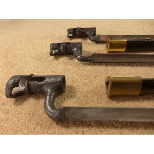 369 - A MARTINI HENRY TYPE BAYONET AND TWO SIMILAR BAYONETS (3)