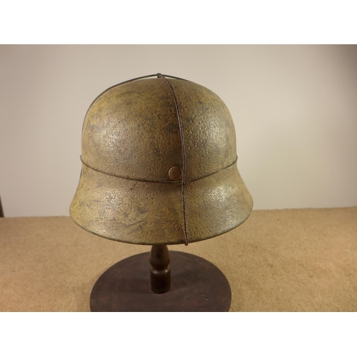 385 - A GERMAN WORLD WAR II PERIOD STEEL HELMET WITH LEATHER LINER, LATER PAINT