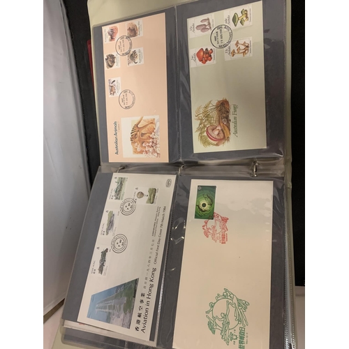 611 - FIRST DAY COVER ALBUM CONTAINING A QUANTITY OF AUSTRALIAN COVERS + FIJI & AAT