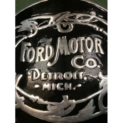 102 - A 'FORD MOTOR COMPANY' BLACK AND SILVER METAL SIGN (D: 49.5CM)