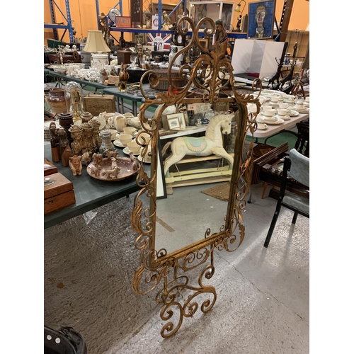 136 - A LARGE MIRROR ON A GILT STAND