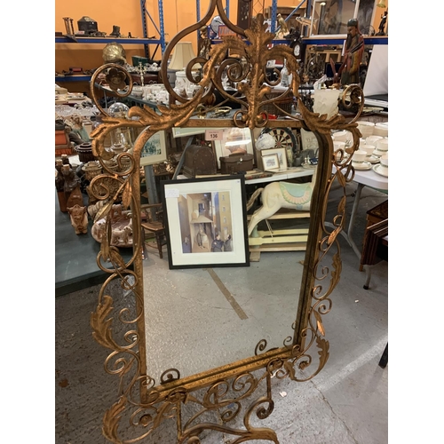 136 - A LARGE MIRROR ON A GILT STAND