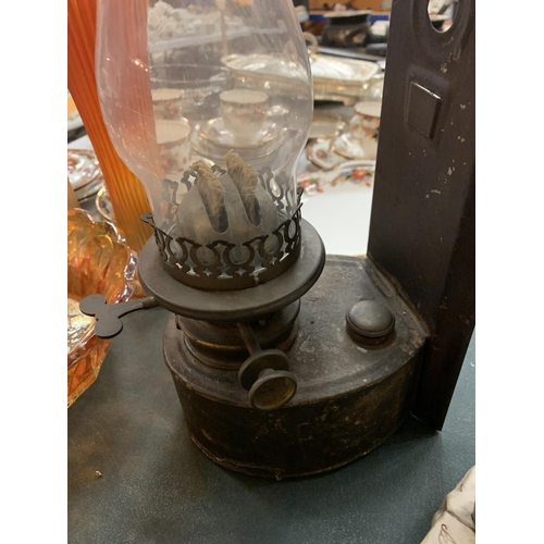 140 - A VINTAGE WALL HUNG OIL LAMP
