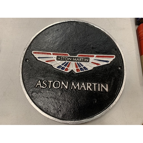 158 - A ROUND CAST METAL 'ASTON MARTIN' SIGN