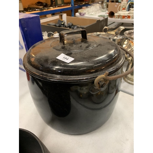 194 - A LARGE ENAMEL LIDDED COOK POT AND TWO  SAUCEPANS ONE BEING CAST IRON