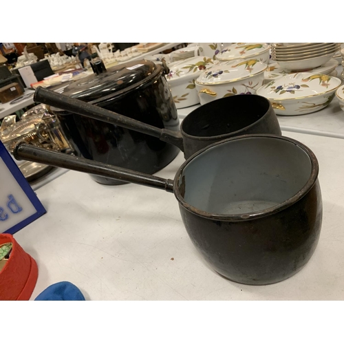 194 - A LARGE ENAMEL LIDDED COOK POT AND TWO  SAUCEPANS ONE BEING CAST IRON