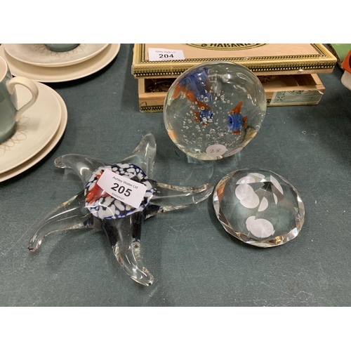 205 - THREE GLASS PAPERWEIGHTS, ONE IN THE SHAPE OF A STAR FISH