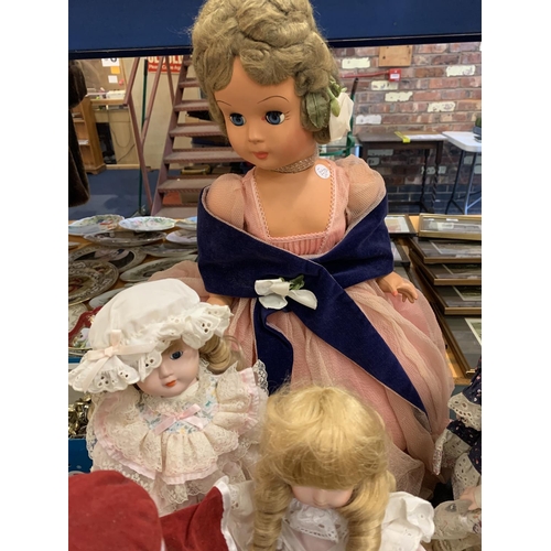 206 - AN ASSORTMENT OF DOLLS TO INCLUDE LARGE VINTAGE EXAMPLES