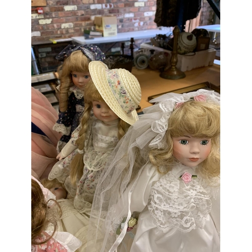 206 - AN ASSORTMENT OF DOLLS TO INCLUDE LARGE VINTAGE EXAMPLES