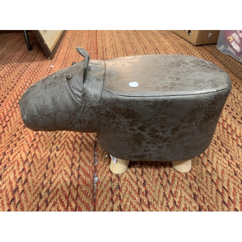 225 - A CHILD'S FAUX LEATHER FOOTSTOOL IN THE FORM OF A HIPPOPOTAMUS