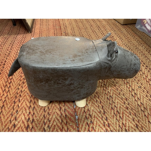 225 - A CHILD'S FAUX LEATHER FOOTSTOOL IN THE FORM OF A HIPPOPOTAMUS