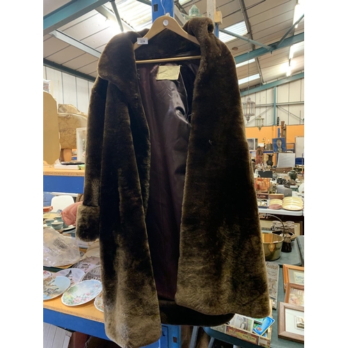 239 - A VINTAGE 'ALPINE' FASHION FURS BROWN COAT