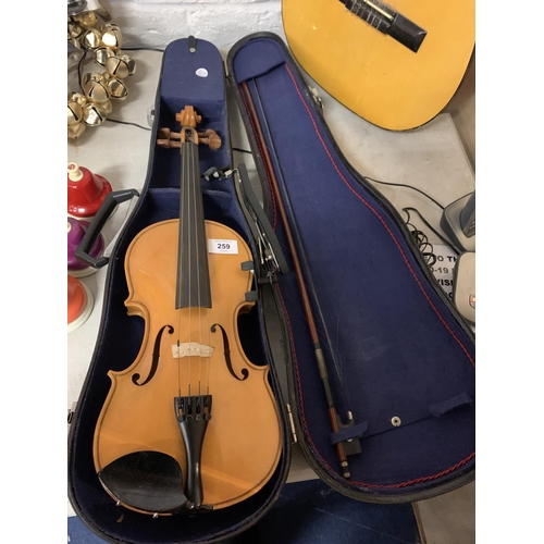 259 - A HALF CASE VIOLIN TO INCLUDE CHIN REST AND BOW