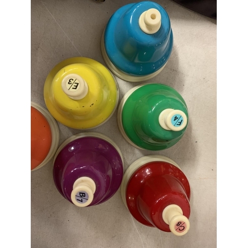 260 - A SET OF RAINBOW MUSICAL HAND BELLS