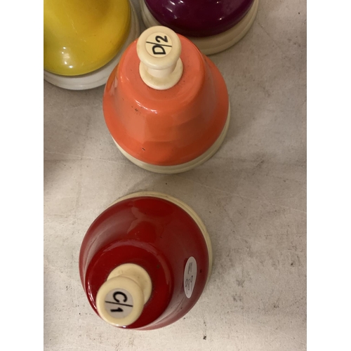 260 - A SET OF RAINBOW MUSICAL HAND BELLS