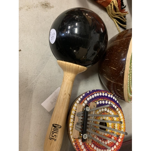 264 - TWO COCONUT DILWE THUMB PIANOS AND A PULSE MARACA