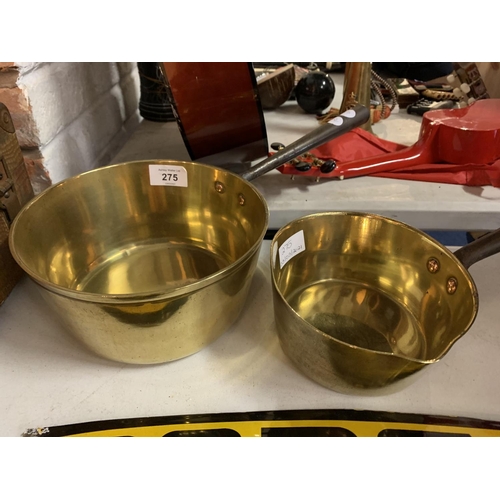 275 - TWO BRASS IRON HANDLED SAUCEPANS