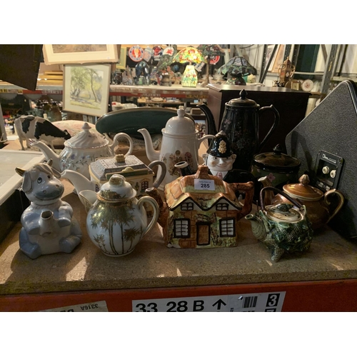 285 - A COLLECTION OF VARIOUS CERAMIC TEAPOTS