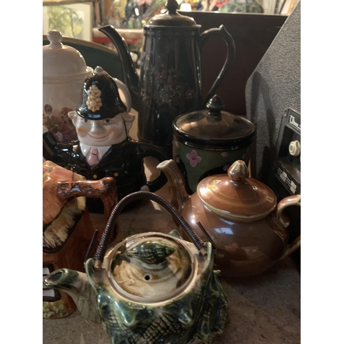 285 - A COLLECTION OF VARIOUS CERAMIC TEAPOTS