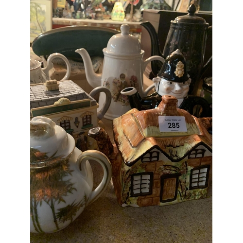 285 - A COLLECTION OF VARIOUS CERAMIC TEAPOTS