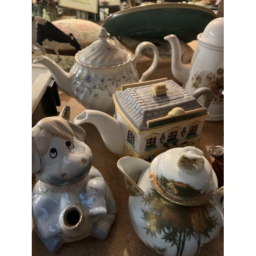 285 - A COLLECTION OF VARIOUS CERAMIC TEAPOTS