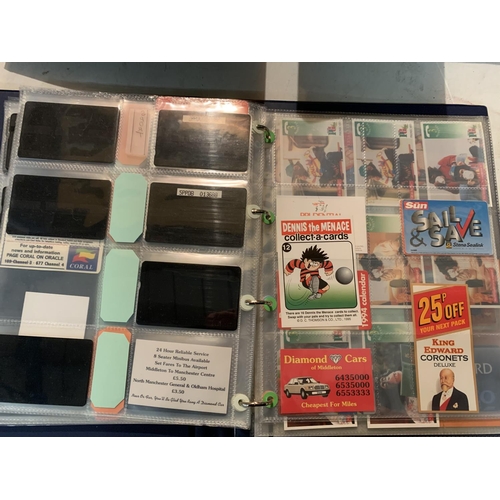 298 - TWO ALBUMS CONTAINING TELEPHONE CARDS, MATCH BOOKS, POSTCARDS ETC AND TWO GUIDE BOOKS