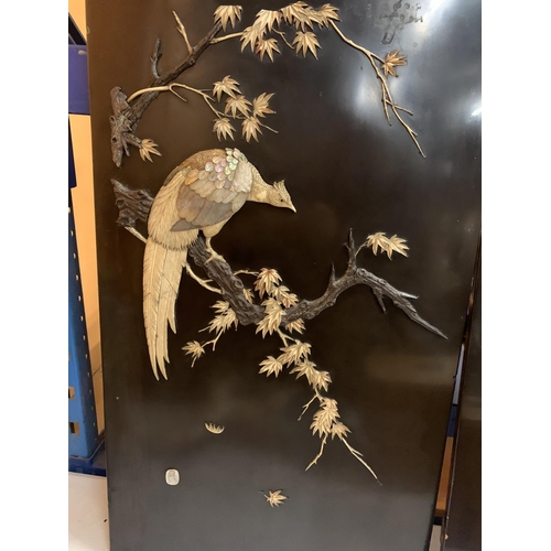 37 - A PAIR OF CHINESE EBONISED WALL PLAQUES DEPICTING MOTHER OF PEARL BIRDS WITH ARTIST'S SIGNED STAMP