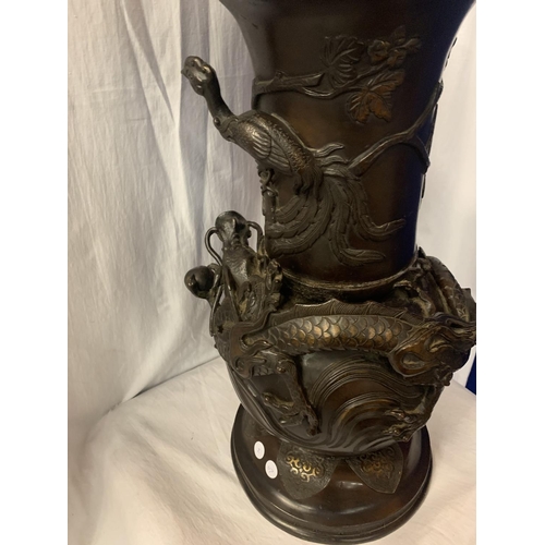 5 - A LARGE DECORATIVE ORIENTAL BRONZE VASE EMBOSSED WITH DRAGON AND BIRD FIGURES - 56CM HIGH 28CM DIAME... 