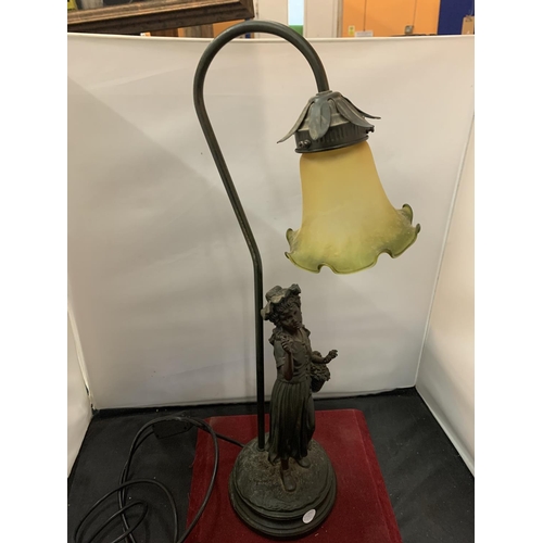 52 - A DECORATIVE FIGURED TABLE LAMP WITH GREEN GLASS SHADE
