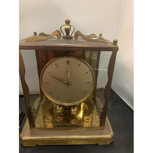 65 - A PAIR OF GERMAN YELLOW METAL MANTEL CLOCKS