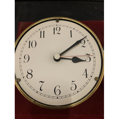 68 - A BRASS SHIPS CLOCK WITH INSCRIPTIONS ON THE REVERSE DIAMETER:15CM