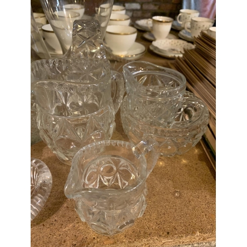 807 - AN ASSORTMENT OF GLASS WARE TO INCLUDE CUT GLASS AND THREE MODERN VASES