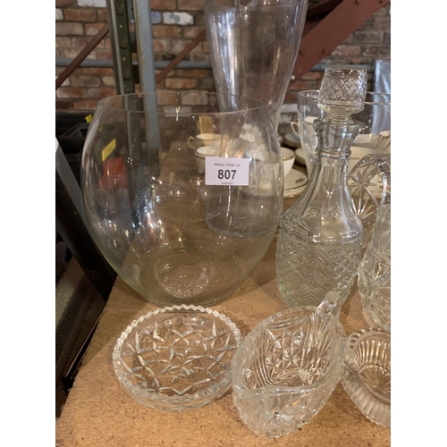 807 - AN ASSORTMENT OF GLASS WARE TO INCLUDE CUT GLASS AND THREE MODERN VASES