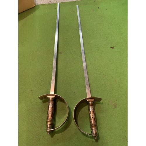 813 - A PAIR OF DECORATIVE STEEL SPANISH SWORDS