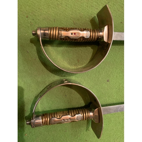 813 - A PAIR OF DECORATIVE STEEL SPANISH SWORDS