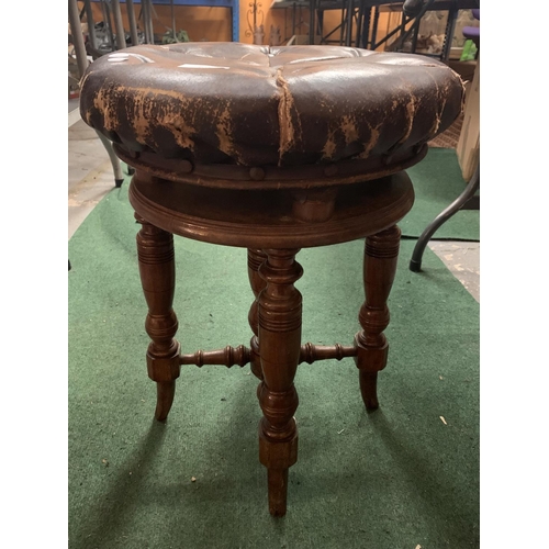 90 - A VINTAGE ROUND LEATHER BUTTONED PIANO STOOL