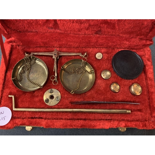 99 - A SET OF SMALL BRASS BALANCE SCALES WITH WEIGHTS