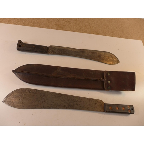 470 - A WORLD WAR II MACHETE AND LEATHER SCABBARD AND A MARTINDALE MACHETE (2)