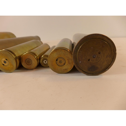 483 - A COLLECTION OF EIGHT BRASS SHELLCASES TO INCLUDE, 20MM DATED 1942, 30MM, 40MM