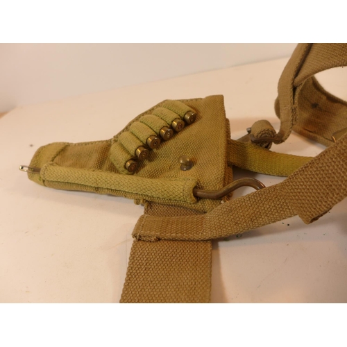 489 - A WORLD WAR II PERIOD HOLSTER DATED 1942 AND A BELT